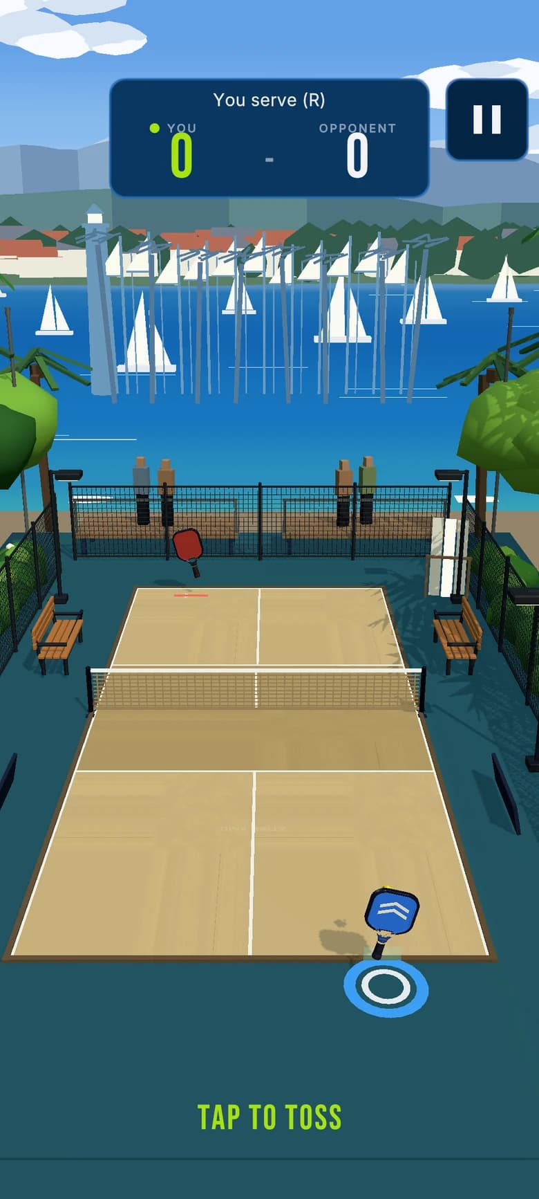 Dink Rally portrait match at the Marina court: a sand-toned court with the net, the opponent's red paddle across the court, the player's blue paddle at the baseline, spectators behind the fence and sailboats in the harbour beyond, with a score card reading You serve, right, 0 to 0.