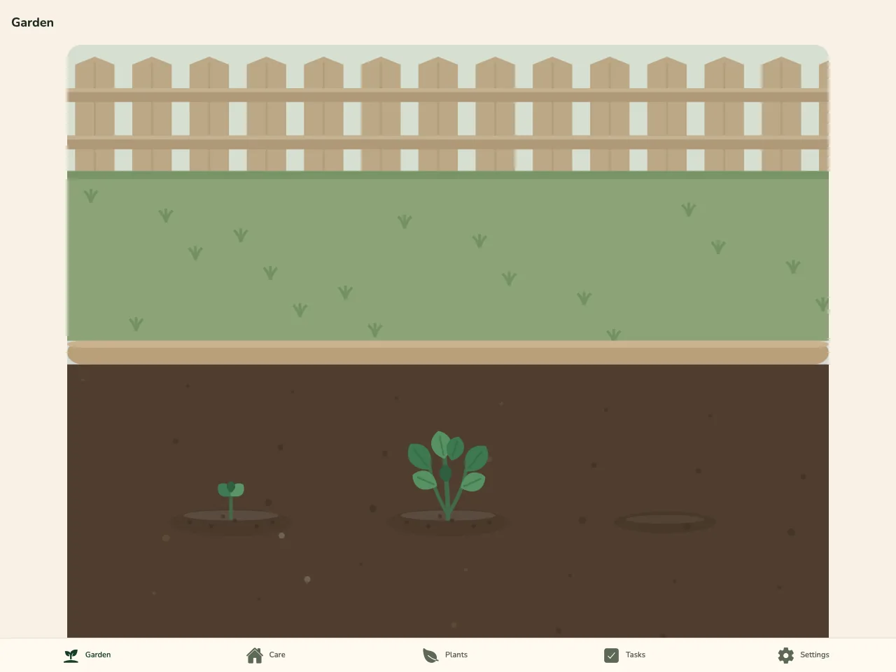 Plantling garden view showing young plants growing in a garden bed beneath a wooden fence.